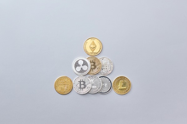Ethereum, Ripple, Bitcoin and Litecoin cryptocurrency coins arranged together