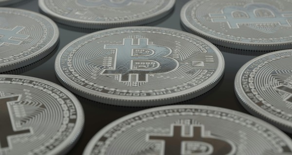 Close-up of silver Bitcoin-style cryptocurrency coins